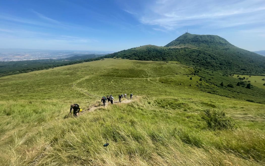 Graham Leonard in Chaîne des Puys earlier this month with other volcanologists, and Clermont-Ferrand in the background.