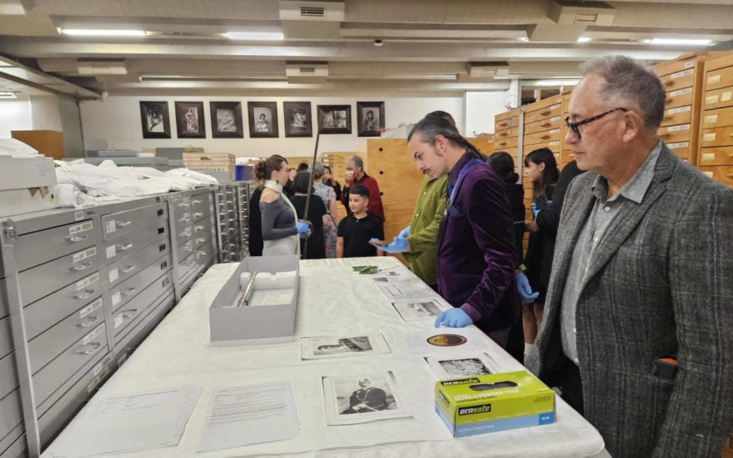 Whānau members look through the taonga housed in Te Papa's archives.
