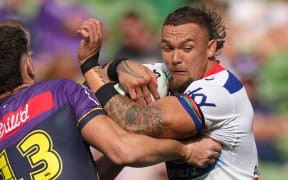 James Fisher-Harris of the Warriors is tackled during the Telstra NRL Premiership match between the NZ Warriors and the Melbourne Storm.