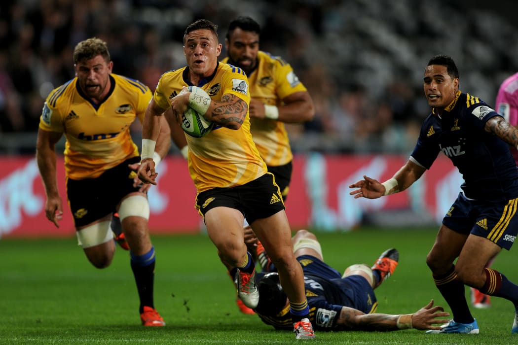 TJ Perenara of the Hurricanes makes a break.