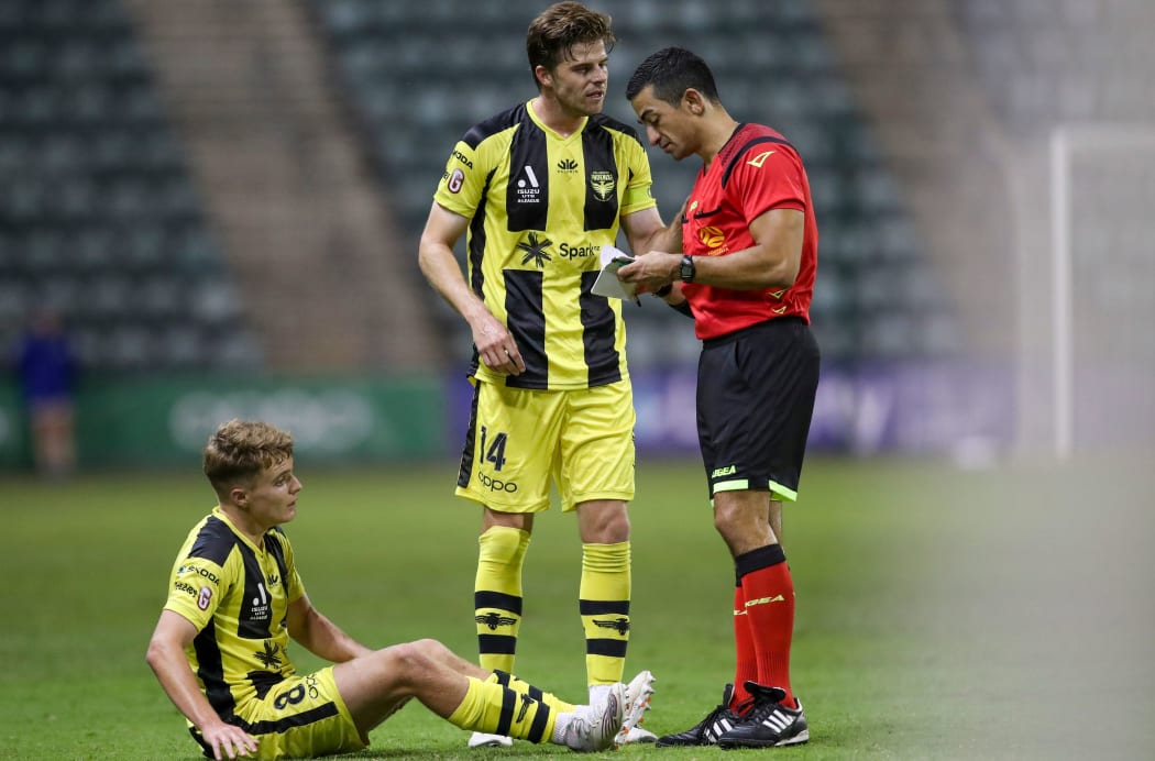 Alex Rufer of the Phoenix talks to the referee during the A League match