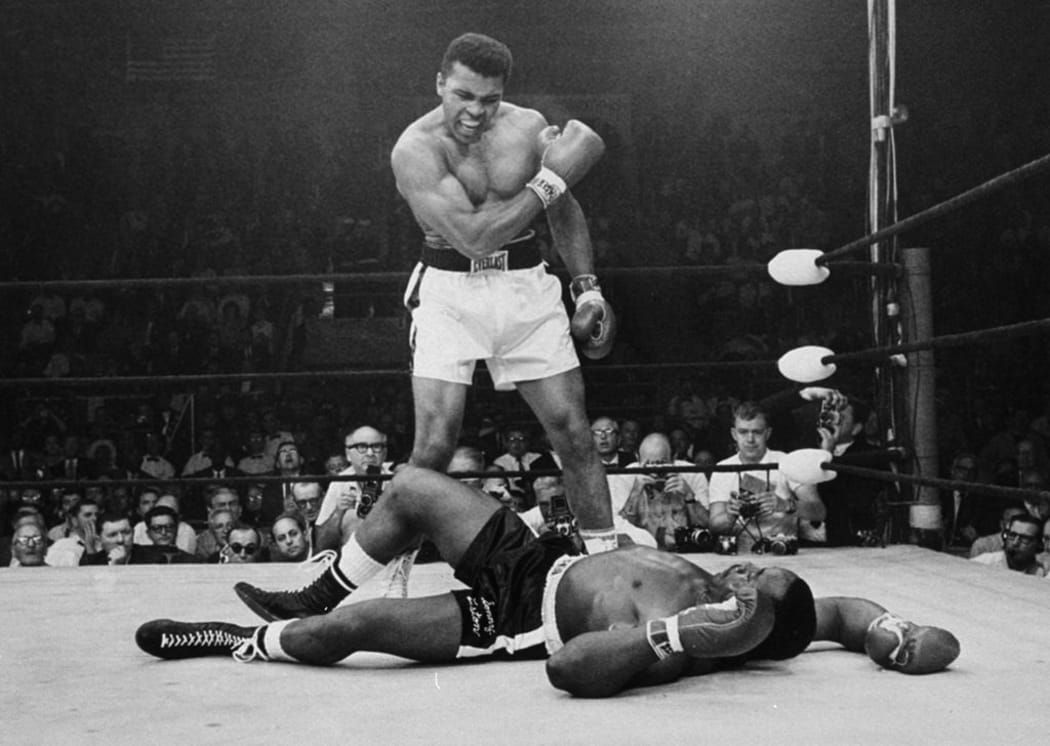 Muhammad Ali knocks down Sonny Liston in 1964.