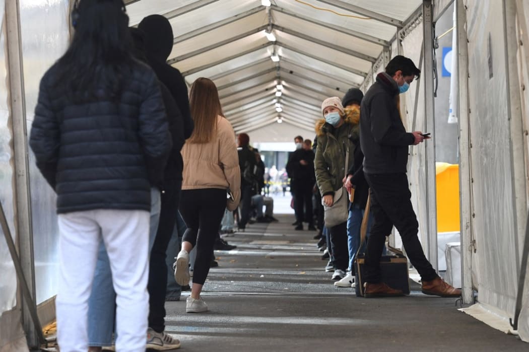 People queue for a Covid-19 test in Melbourne on May 27, 2021 after five million people in Melbourne were ordered into a snap week-long lockdown following another Covid-19 virus outbreak.