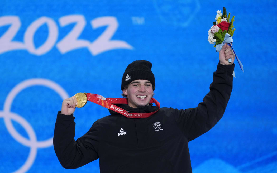 Gold medalist Nico Porteous (NZL) celebrates during the medals ceremony for the men's freestyle skiing halfpipe during the Beijing 2022 Olympic Winter Games