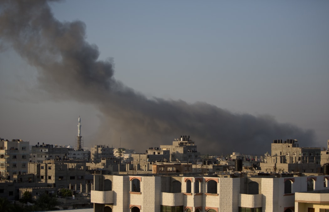 Smoke billows from buildings in Gaza City on Wednesday.