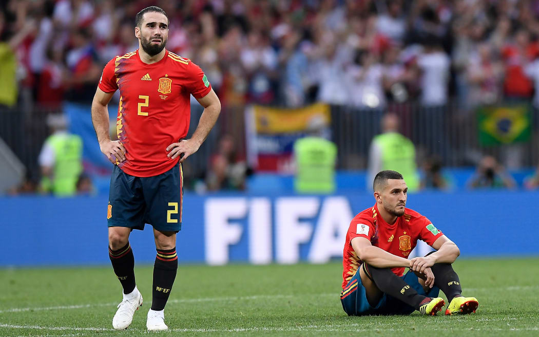 Spanish players reflect on their shock loss to Russia.