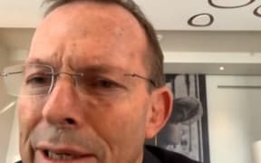 A video grab from footage broadcast by the UK Parliament's Parliamentary Recording Unit (PRU) shows Australian former prime minister Tony Abbott speaking to the Foreign Affairs Committee by remote video feed.