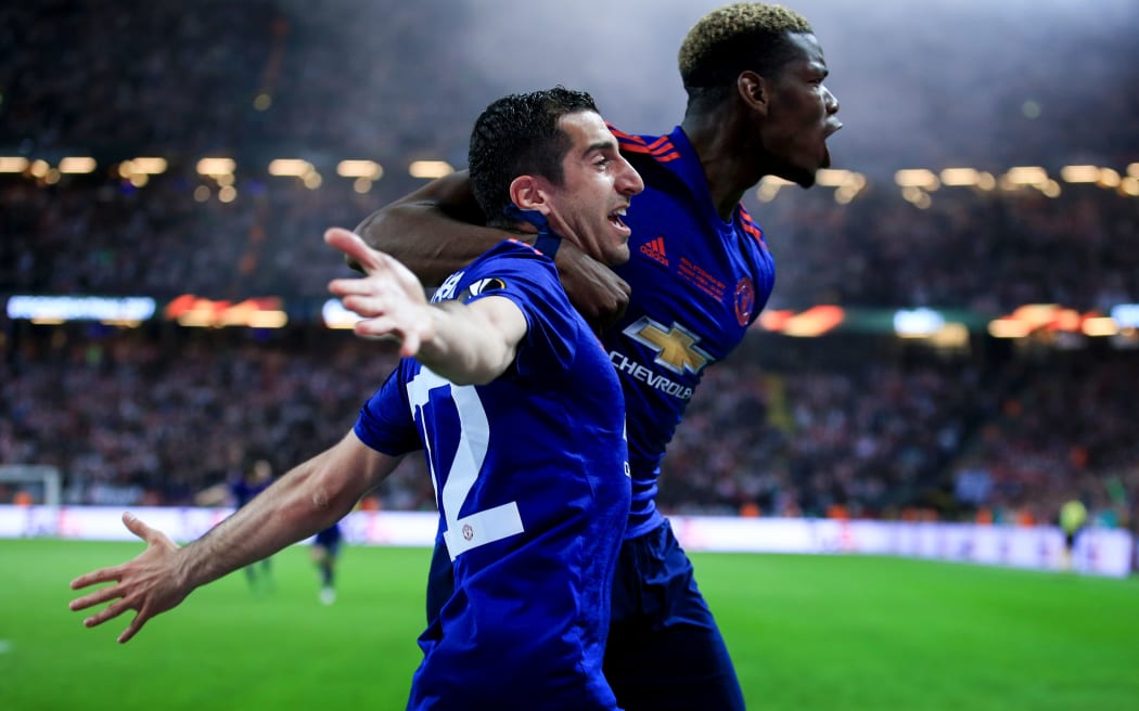 Henrikh Mkhitaryan of Manchester United celebrates his goal with Paul Pogba.