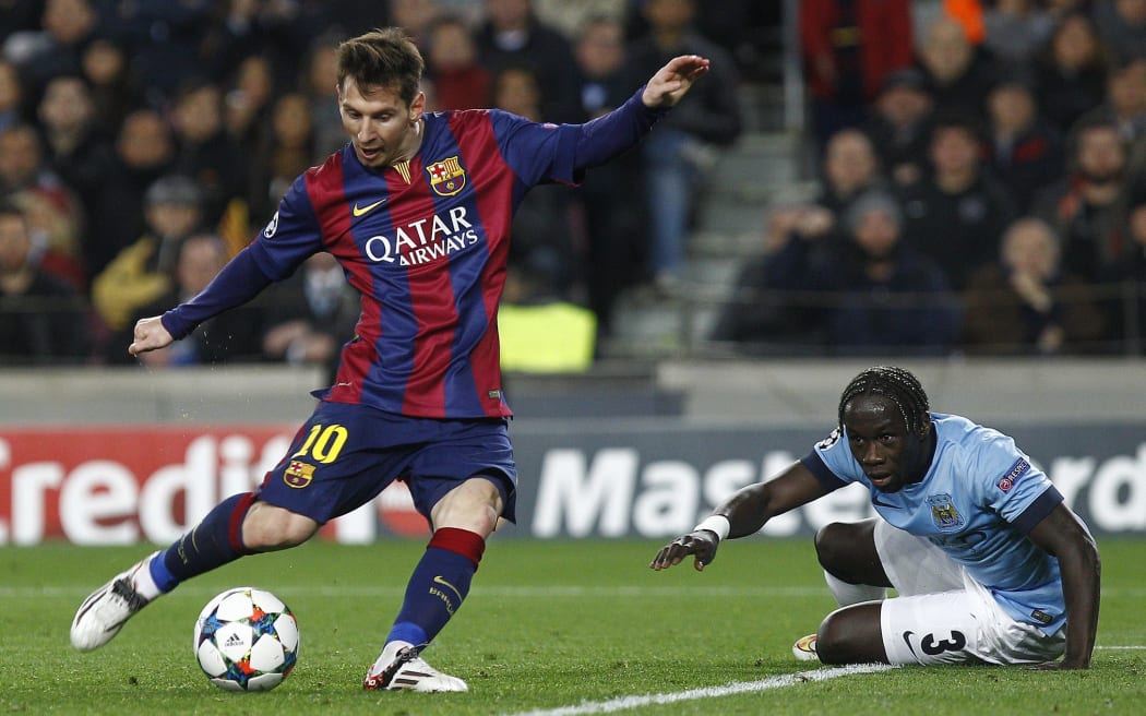 Lionel Messi shoots against Manchester City.