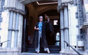 UC Arts City Location Manager Naomi van den Broek models a gown once worn on a daily basis by academic staff.