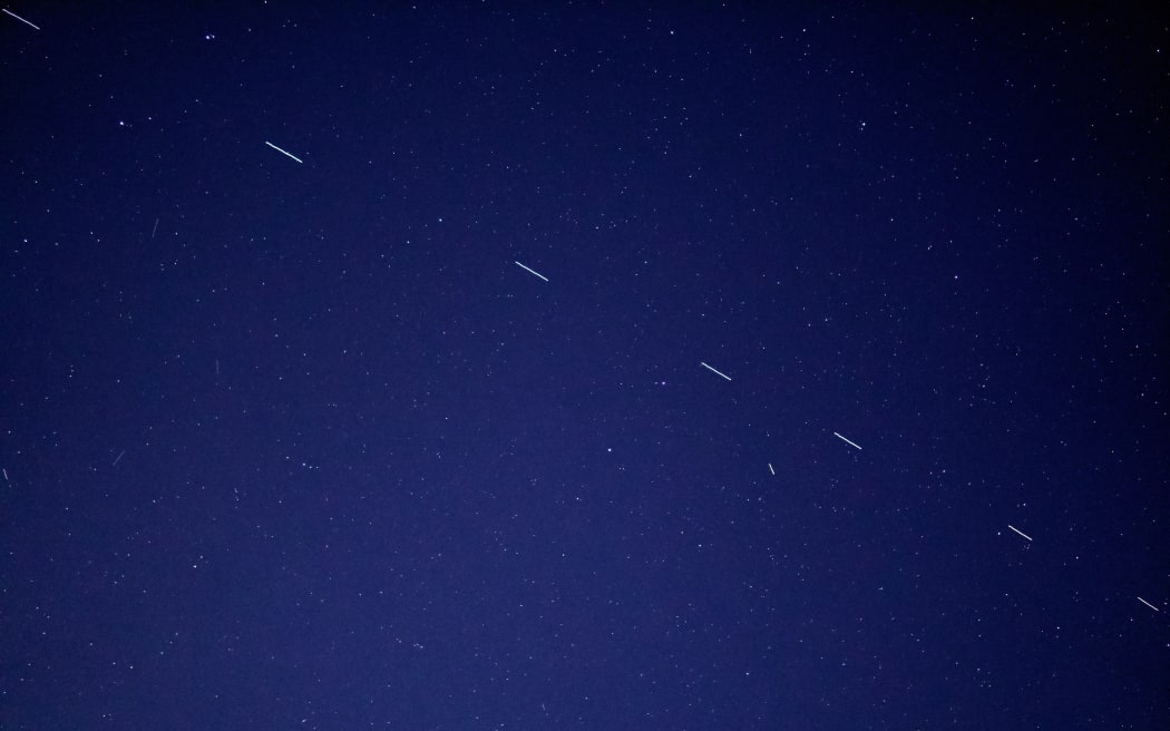 The Starlink 3 train rides across the early morning sky, accompanied by a handful of other satellites.