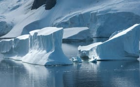 Icebergs in the strait between the islands off the west coast of the Antarctic Peninsula