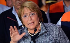 President Michelle Bachelet was moved to higher ground while visiting the damaged city of Arica.