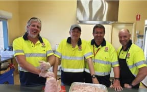 New Zealand Salvos (from left) Captain Karl Foreman, Captain Steve Molen, Michael Douglas and Captain Robert Adams assist at the Moruya Evacuation Centre in NSW.