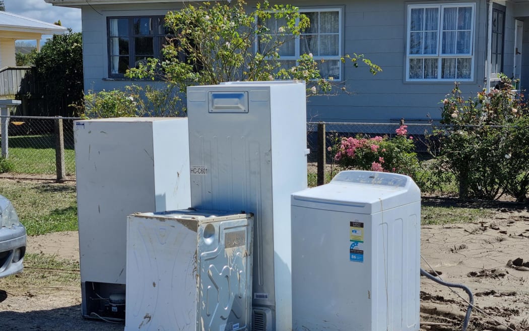 Damaged appliances sit on the side of the road in Wairoa following Cyclone Gabrielle.