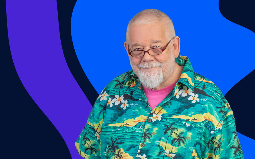 Host William Dart in a bright Hawaiian shirt stands in front of background of abstract shapes in blue and purple on a dark background.