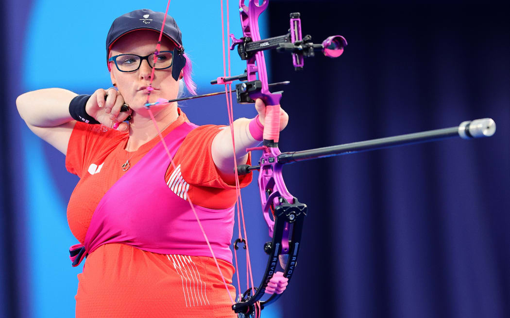 PARIS, FRANCE - AUGUST 31: Jodie Grinham of Team Great Britain competes against Phoebe Paterson Pine (not pictured) of Team Great Britain in the Para Archery Women's Individual compound Open Bronze Medal contest on day three of the Paris 2024 Summer Paralympic Games at Esplanade Des Invalides on August 31, 2024 in Paris, France. (Photo by Alex Slitz/Getty Images)