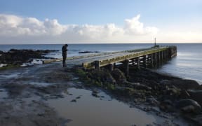 Near the main township Waitangi, Chatham Islands, University of Canterbury student Kristie-Lee Thomas is “GPS-ing infrastructure and collecting asset attributes for the impact assessment” for her disaster risk and resilience thesis.