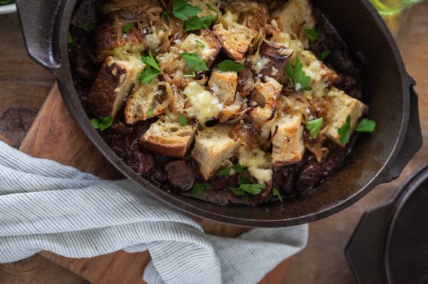 Beef and mushroom stew with sourdough, caramelised onions and cheddar topping