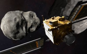 This artist's illustration shows the DART spacecraft from behind prior to impact at the Didymos binary system. NASA plans to crash a spacecraft into an asteroid next year in a test of "planetary defense."