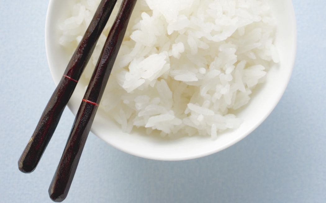 Bowl of rice with chopsticks (Photo by Foodcollection GesmbH / foodcollection / foodcollection via AFP)