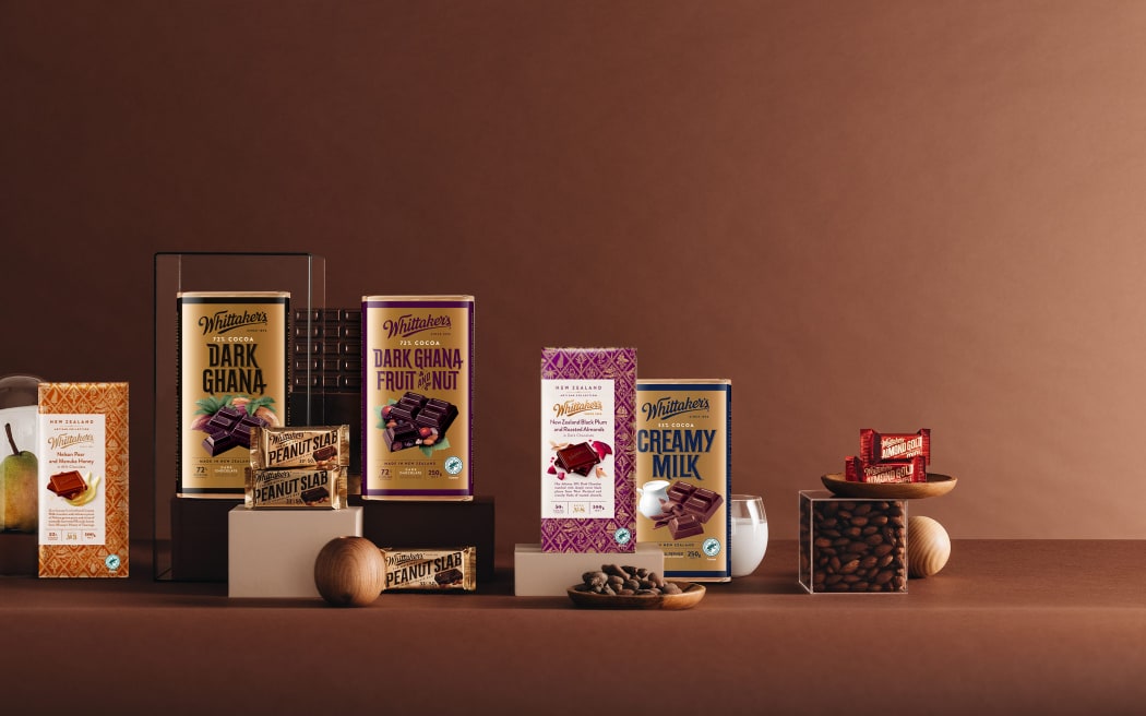 A line up of chocolate bars from Whittaker's, including Dark Ghana, Fruit & Nut, Creamy Milk, and Peanut Slab.