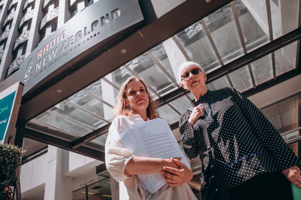 Margaret Guldborg and Elizabeth Kerr deliver a 26,000 signature petition to RNZ house in Wellington calling for a halt to proposed redundancies at RNZ Concert