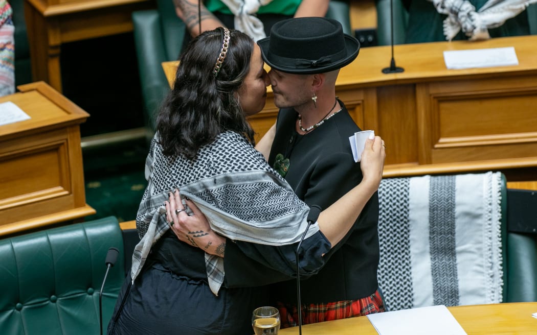 Green Party MPs Kahurangi Carter and Benjamin Doyle hongi after Doyle makes their maiden statement