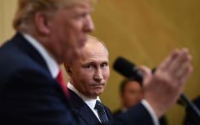 US President Donald Trump and Russia's President Vladimir Putin attend a joint press conference after a meeting at the Presidential Palace in Helsinki.