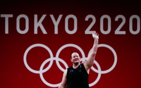 New Zealand's Laurel Hubbard waves during the women's +87kg weightlifting Group B competition at the Tokyo 2020 Olympic Games.