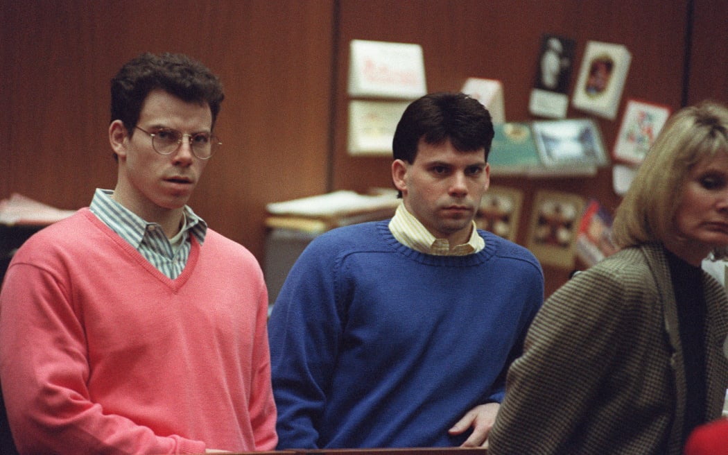 Erik Menendez (L) and his brother Lyle (R) listen during a pre-trial hearing, on December 29, 1992 in Los Angeles after the two pleaded innocent in the August 1989 shotgun deaths of their wealthy parents, Jose and Mary Louise Menendez of Beverly Hills, Calif. It took 40 months for the Superior Court arraignment after prosecutors and defense attorneys battled over the admissibility of taped confessions the brothers allegedly made to their psychotherapist. AFP PHOTO VINCE BUCCI (Photo by VINCE BUCCI / AFP)
