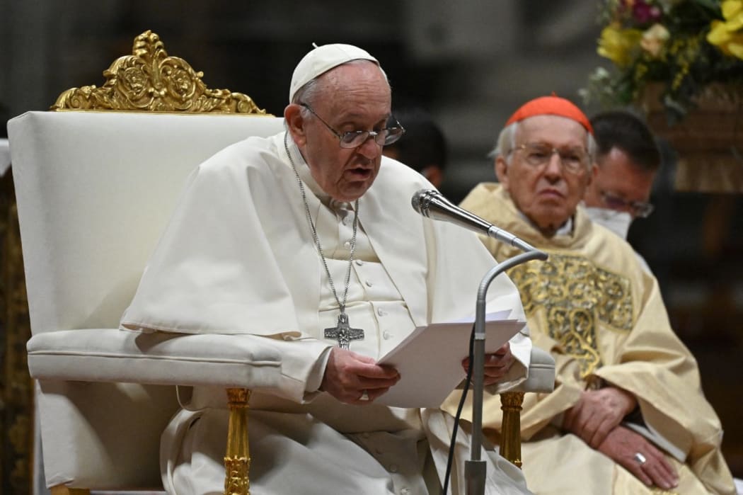 Pope Francis delivers the homily next to Italian Cardinal Giovanni Battista Re, during the Easter Vigil mass on April 16, 2022 at St. Peter's Basilica in The Vatican.