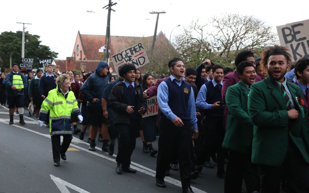 Students chant as they march through the streets of Ōtāhuhu to rally against inter-school violence.