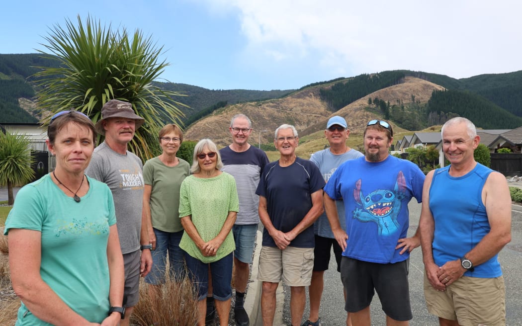 Kathryn Richards (front left) and the Friends of Marsden Valley had warned that a slip around Glider Road was likely after pines had been harvested.