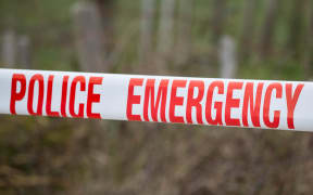 Police tape cordons off the property at Taharoa.