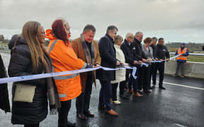 The ribbon being cut at the formal opening of the Ahu a Turanga Highway.