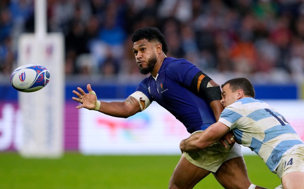 Samoa's inside centre Tumua Manu (centre) is tackled by Argentina's wing Emiliano Boffelli during the Rugby World Cup Pool D match at Stade Geoffroy-Guichard in Saint-Etienne, south-eastern France on 22 September, 2023.
