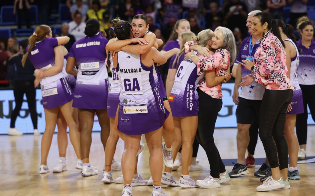 Stars' players and management celebrate victory over the Pulse in their ANZ Premiership Elimination Final in Porirua.