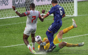 Samoa's Pele Fatu makes a great save ahead of Tahiti's Eddy Kaspard. FIFA World Cup 2026 - OFC Qualifiers, Samoa v Tahiti, FMG Stadium Hamilton, Friday 15 November 2024. Photo: Shane Wenzlick / www.phototek.nz