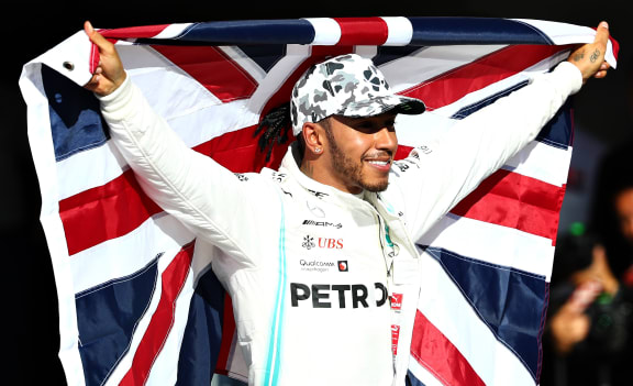 AUSTIN, TEXAS - NOVEMBER 03: 2019 Formula One World Drivers Champion Lewis Hamilton of Great Britain and Mercedes GP celebrates in parc ferme during the F1 Grand Prix of USA at Circuit of The Americas on November 03, 2019 in Austin, Texas.