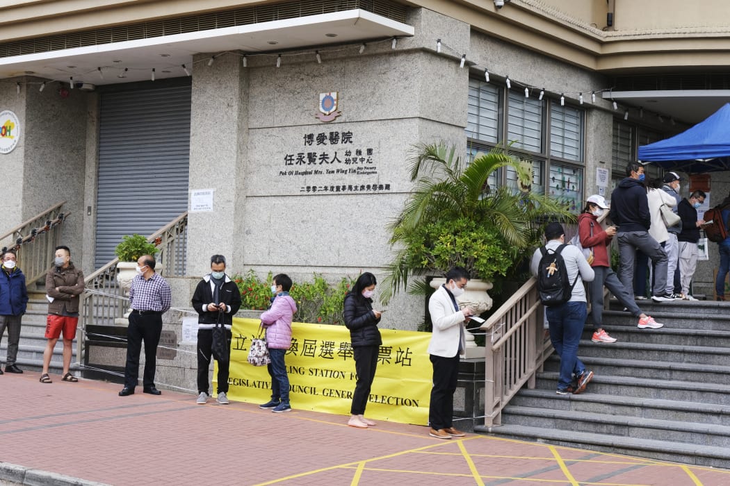Voters wait to cast ballots in the election for the seventh-term Legislative Council (LegCo) of the Hong Kong Special Administrative Region at a polling station in Whampoa.