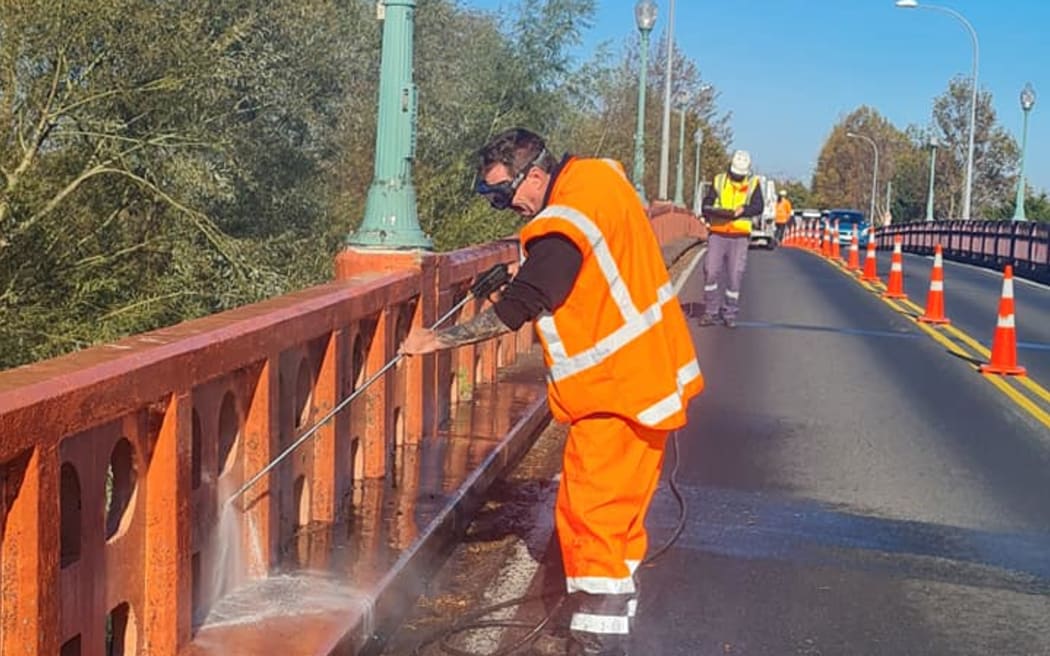 Moss removal on Te Aroha Bridge ahead of its big re-painting.