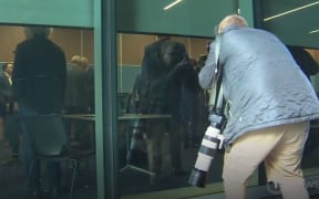 Media excluded from Auckland mayor Wayne Brown's briefing on budget proposals last Thursday  - reduced to peeking through the windows.