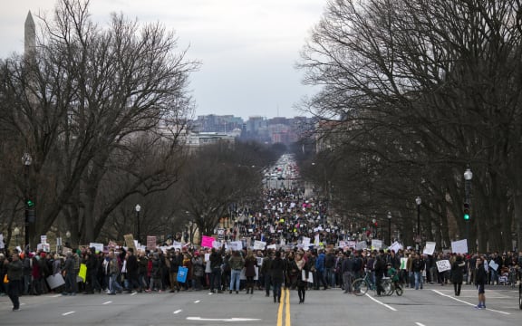 Demonstrators march to the Capitol in protest of President Donald Trump's immigration policies on January 29.