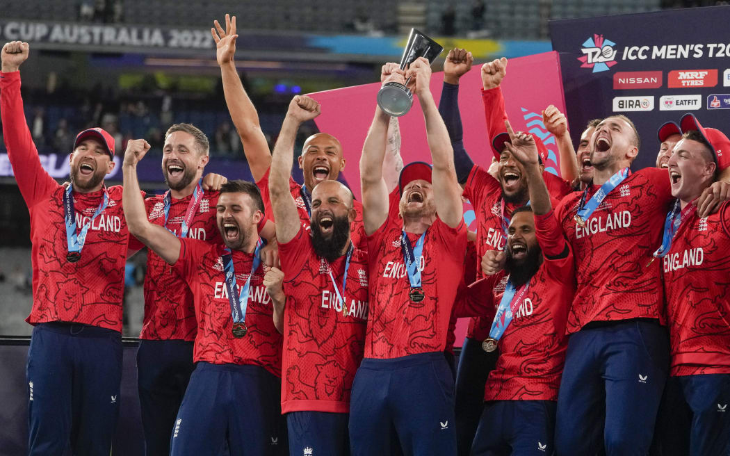 FILE - England celebrate with their trophy after defeating Pakistan in the final of the T20 World Cup cricket at the Melbourne Cricket Ground in Melbourne, Australia, Sunday, Nov. 13, 2022. The return of fast bowler Jofra Archer has boosted England's chances of becoming the first team to win consecutive Twenty20 World Cups.(AP Photo/Mark Baker, File)