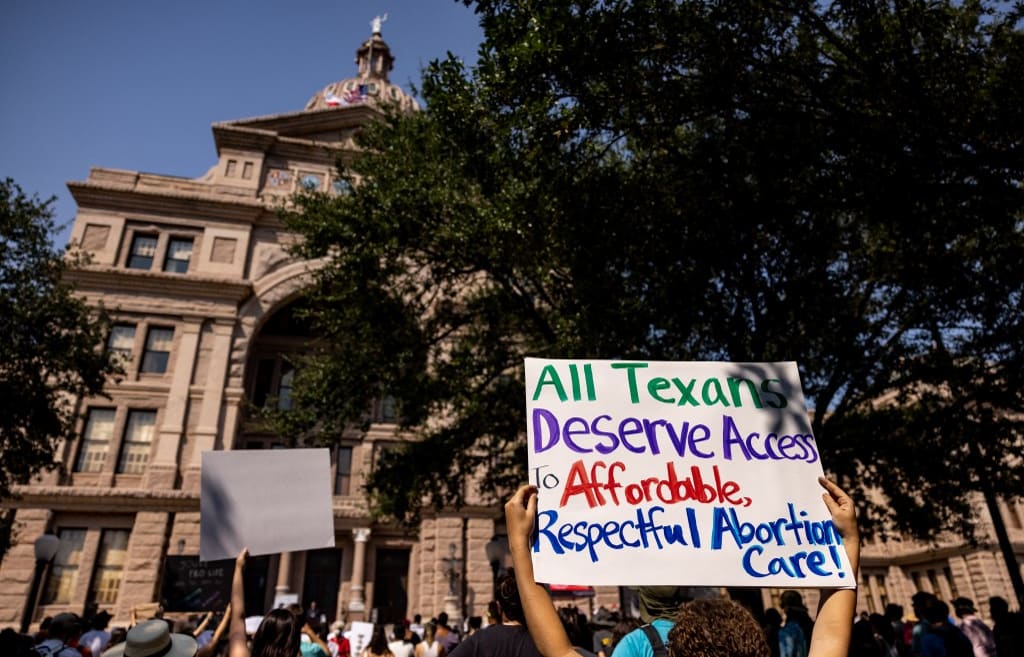 Abortion rights activists rally at the Texas State Capitol after lawmakers passed several pieces of conservative legislation, including SB8.