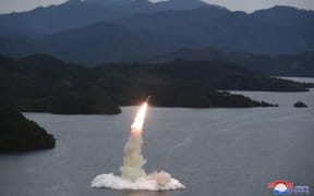 This undated picture released from North Korea's official Korean Central News Agency (KCNA) on 10 October, 2022 shows a Hokkaido missile launch training test by the Korean People's Army Tactical Nuclear Operation Unit at an undisclosed location.