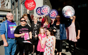 Campaigners backing school support staff gather outside the Employment Relations Authority hearing in Wellington on 7 April.