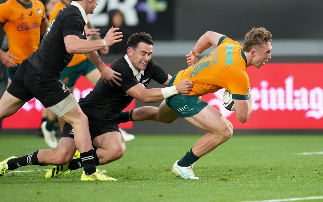 Australia's Harry Potter scores a try.