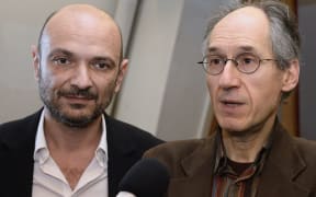 'Charlie Hebdo' editor-in-chief Gerard Briard (R) and lawyer Richard Malka (L) at the headquarters of French newspaper 'Liberation' on 9 January.